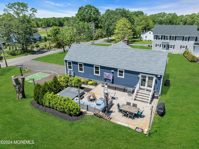 rear view of property with a patio and outdoor lounge area