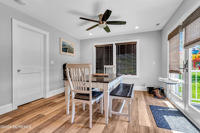 dining space featuring light wood-type flooring and ceiling fan