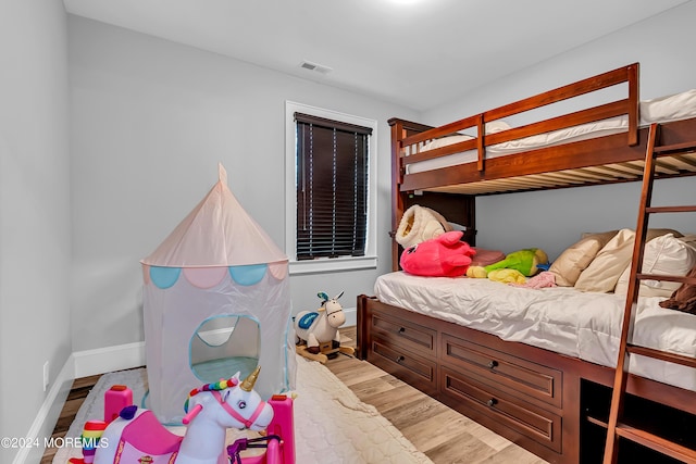 bedroom with hardwood / wood-style floors