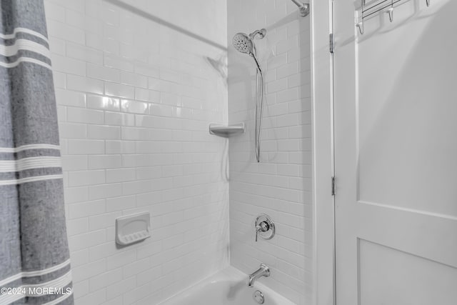 bathroom with shower / tub combo with curtain