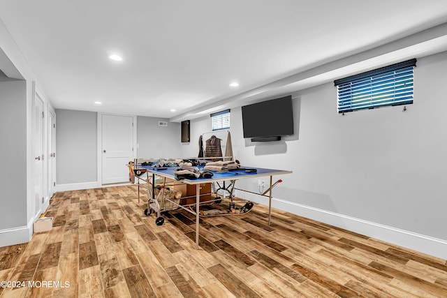 playroom with light hardwood / wood-style flooring