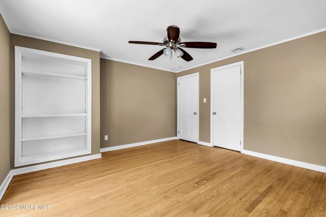 interior space featuring ceiling fan, light hardwood / wood-style flooring, and ornamental molding