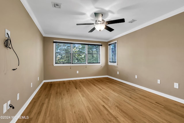 unfurnished room featuring ceiling fan, light wood-type flooring, and crown molding