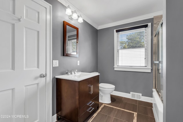 full bathroom with shower / bath combination with glass door, toilet, crown molding, tile flooring, and vanity