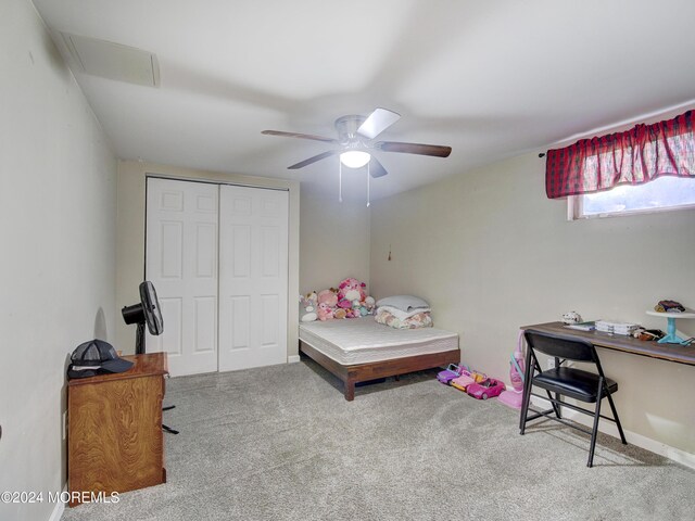 bedroom with a closet, carpet, and ceiling fan