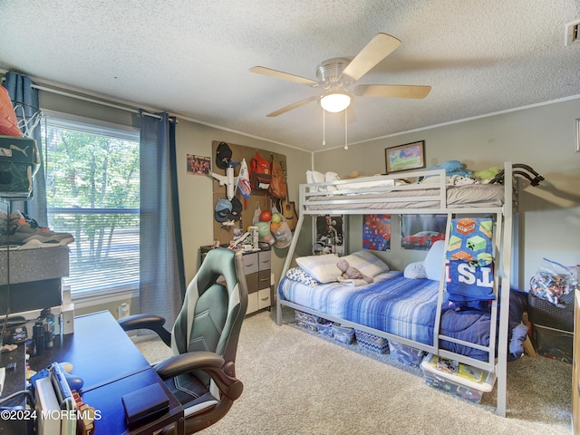 carpeted bedroom with a textured ceiling and ceiling fan