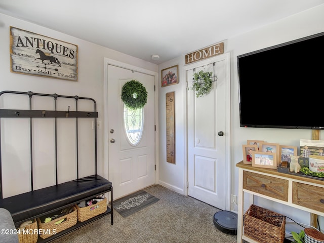 foyer entrance featuring carpet floors