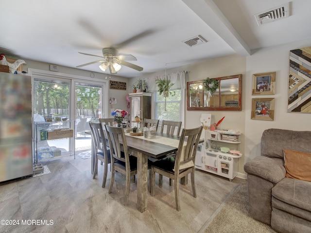 dining area with carpet flooring and ceiling fan