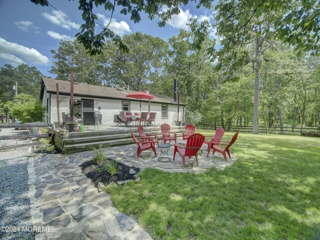 view of yard featuring a deck and a patio