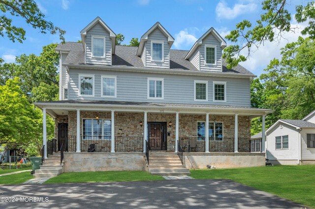 view of front of home with a front lawn and a porch