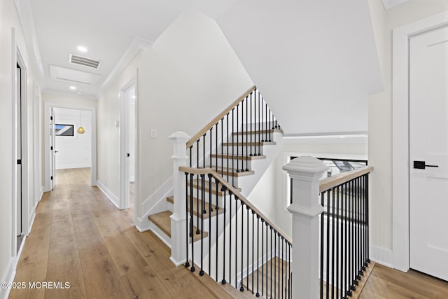 staircase featuring hardwood / wood-style flooring