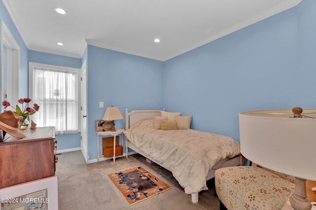 bedroom with ceiling fan, light colored carpet, and crown molding