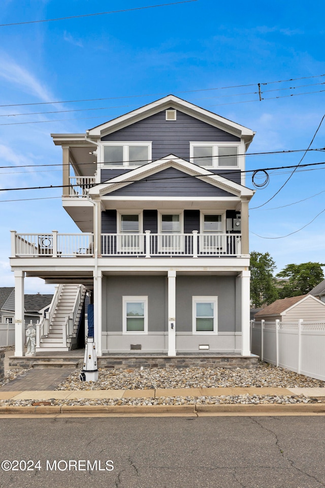 view of front of property with a balcony