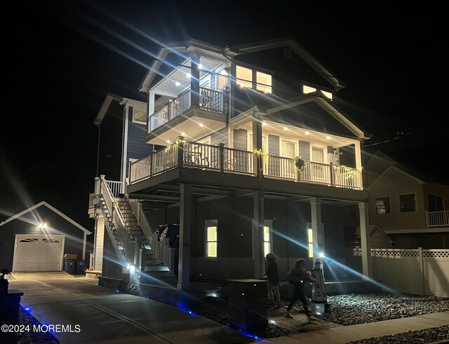 view of front of house with a garage and a balcony