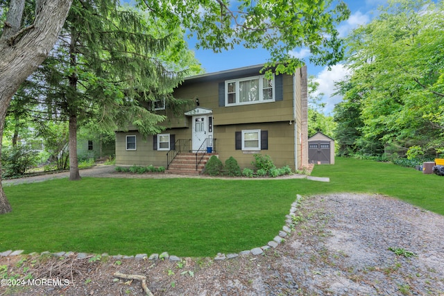 split foyer home with a front lawn