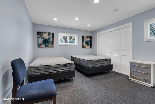 carpeted bedroom featuring a closet