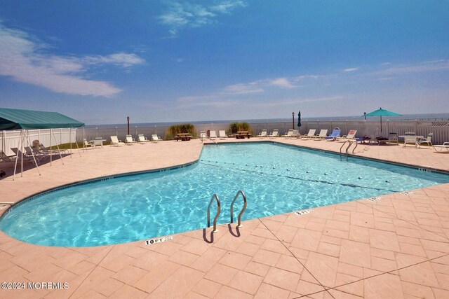 view of pool featuring a patio