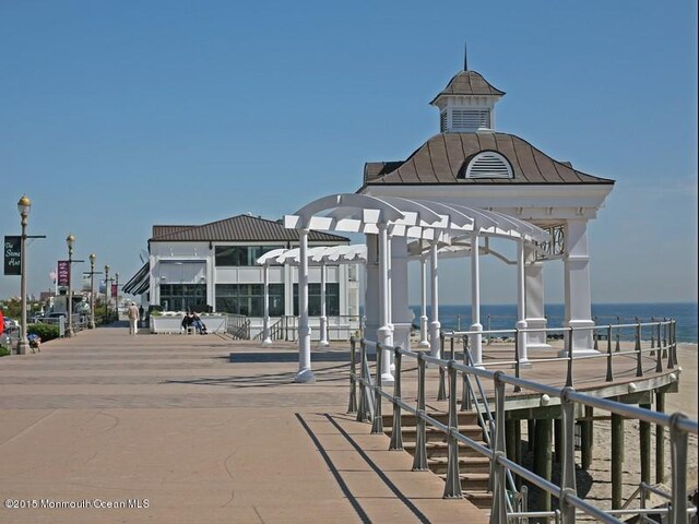 exterior space featuring a pergola and a water view