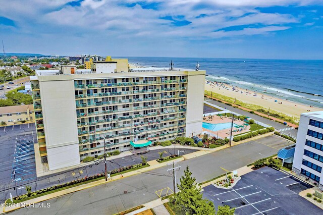 bird's eye view with a view of the beach and a water view