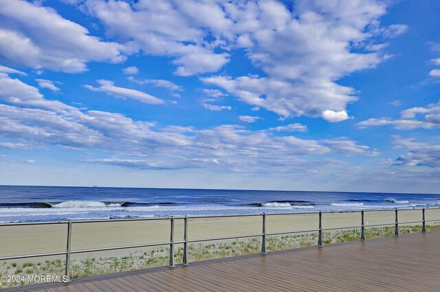 deck featuring a water view