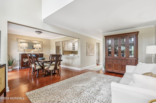 living room with dark hardwood / wood-style floors and ornamental molding