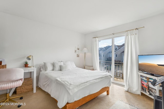 bedroom with access to outside and light colored carpet