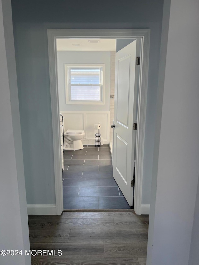 corridor featuring dark wood-type flooring