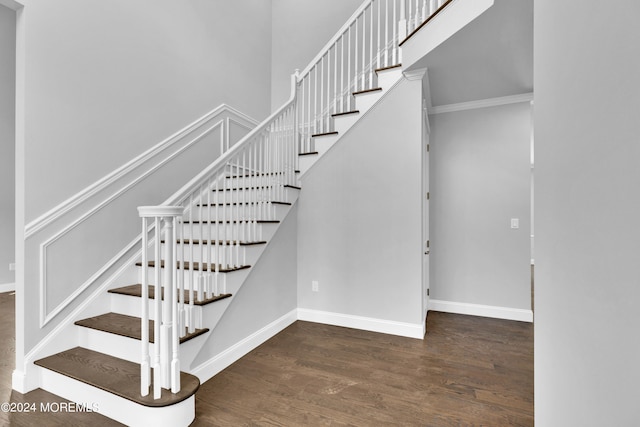 staircase featuring hardwood / wood-style flooring