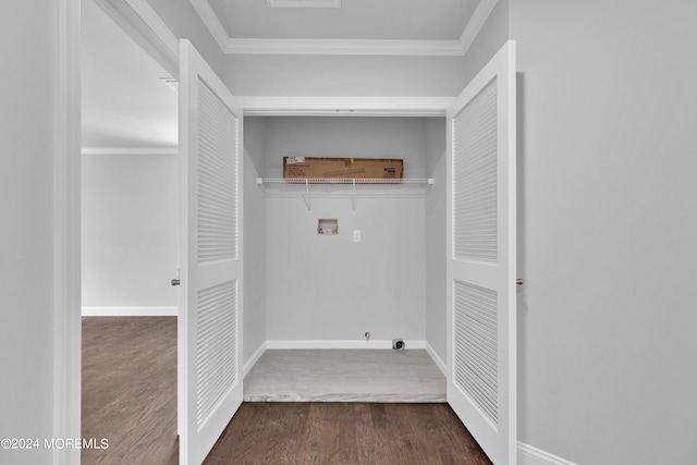 laundry room featuring dark hardwood / wood-style flooring, crown molding, and hookup for a washing machine