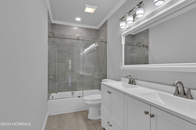 full bathroom featuring shower / bath combination with glass door, vanity, toilet, and crown molding