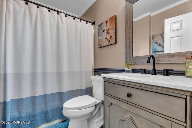 bathroom featuring ornamental molding, toilet, vanity, and a shower with shower curtain