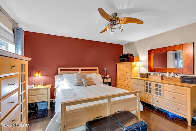 bedroom with dark wood-style flooring