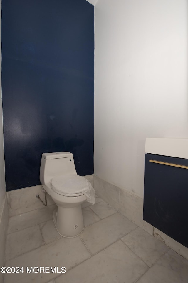 bathroom featuring tile patterned floors and toilet