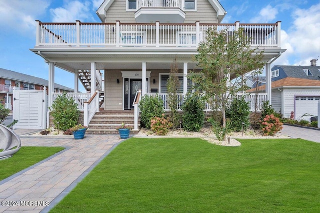 view of front of home with a porch and a front yard