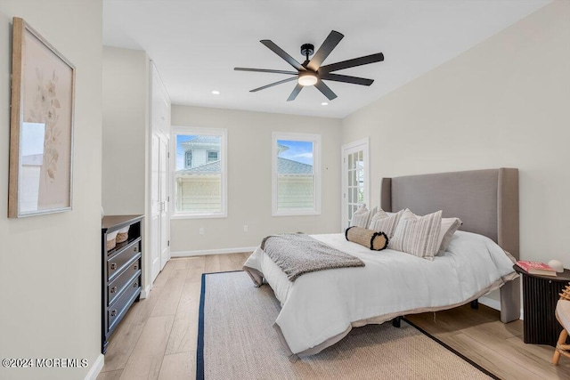 bedroom featuring ceiling fan and light hardwood / wood-style flooring