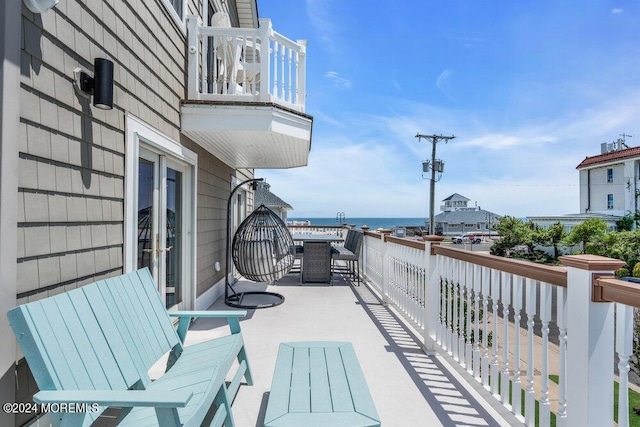 balcony featuring a water view