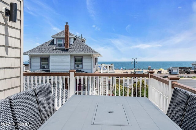 deck featuring a water view