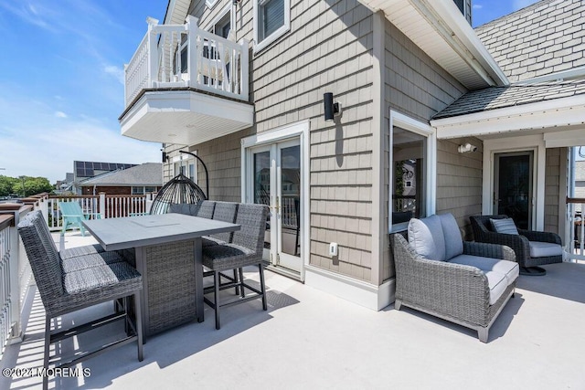 view of patio featuring a balcony