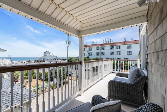 balcony featuring a water view