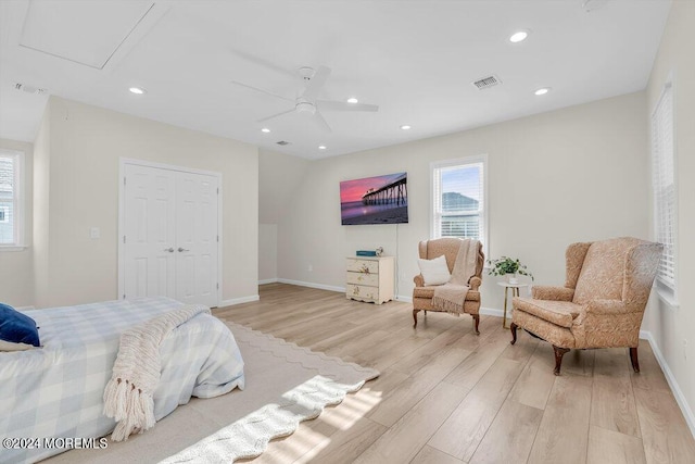 bedroom with ceiling fan and light hardwood / wood-style flooring