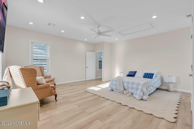 bedroom with ceiling fan and light hardwood / wood-style flooring