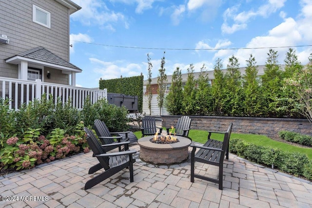 view of patio / terrace featuring a fire pit