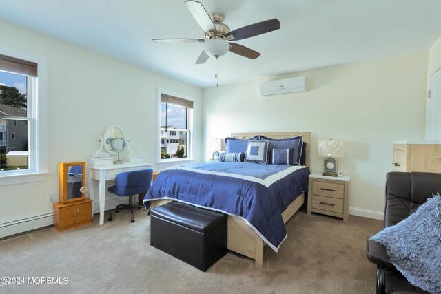 bedroom featuring carpet floors, baseboard heating, an AC wall unit, and ceiling fan