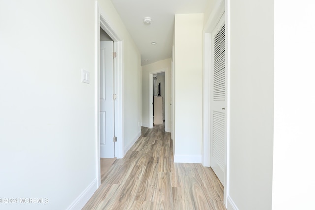 hallway featuring light wood-type flooring