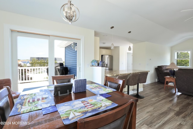 dining room featuring dark hardwood / wood-style flooring and lofted ceiling