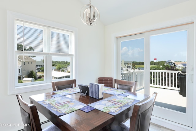 dining space with a chandelier