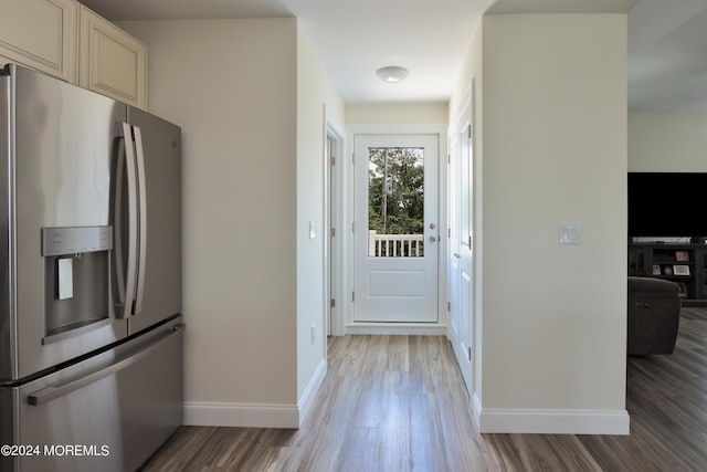 kitchen with stainless steel fridge and light wood-type flooring