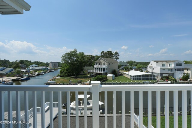 balcony featuring a water view