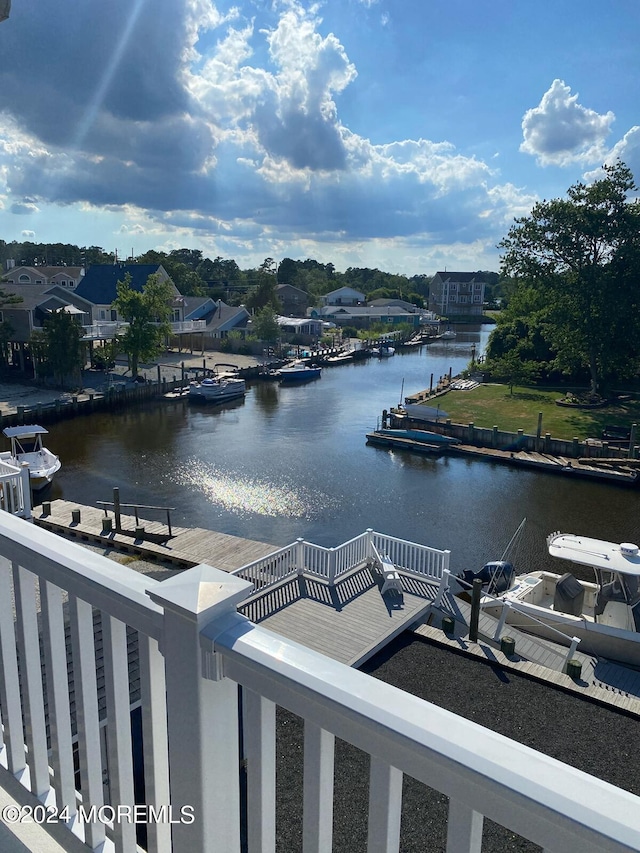 property view of water with a dock