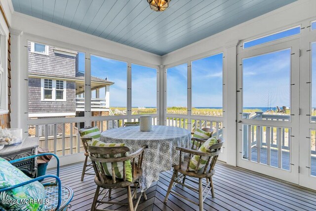 sunroom with wood ceiling